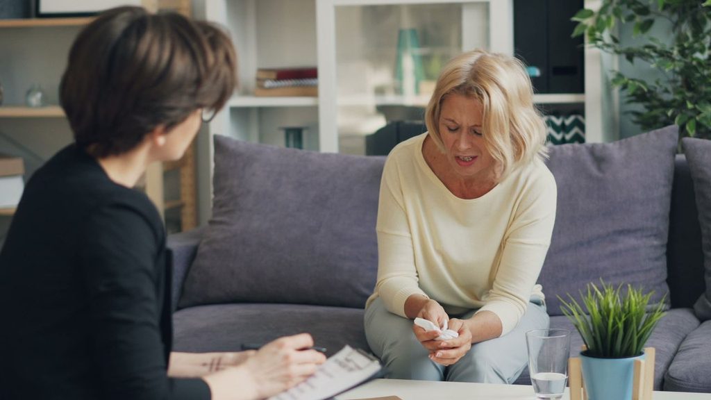 A woman speaking to a counsellor at home